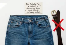 A pair of jeans with a safety pin securing the waistband. A belt is crossed out. A sign says "60 Seconds – No Sewing – No Belt."