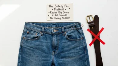 A pair of jeans with a safety pin securing the waistband. A belt is crossed out. A sign says "60 Seconds – No Sewing – No Belt."