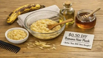 An overripe banana, a bowl of mashed banana, olive oil, and honey on a kitchen counter. A split image shows frizzy hair on the left and smooth, shiny hair on the right. A sign says "$0.50 – Better than $40 masks."