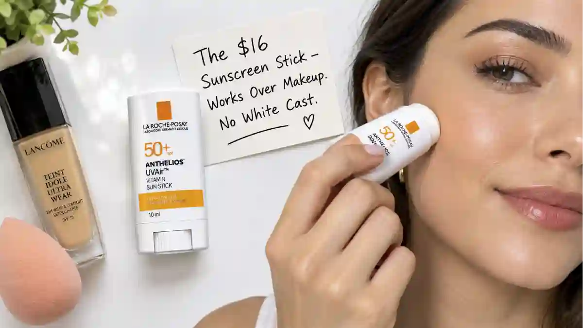 The La Roche-Posay Anthelios UVAir Vitamin Sun Stick SPF50+ in its compact 10ml tube. Next to it, a hand applying the stick over a full face of makeup. A sign says "$16 – Works Over Makeup, No White Cast."
